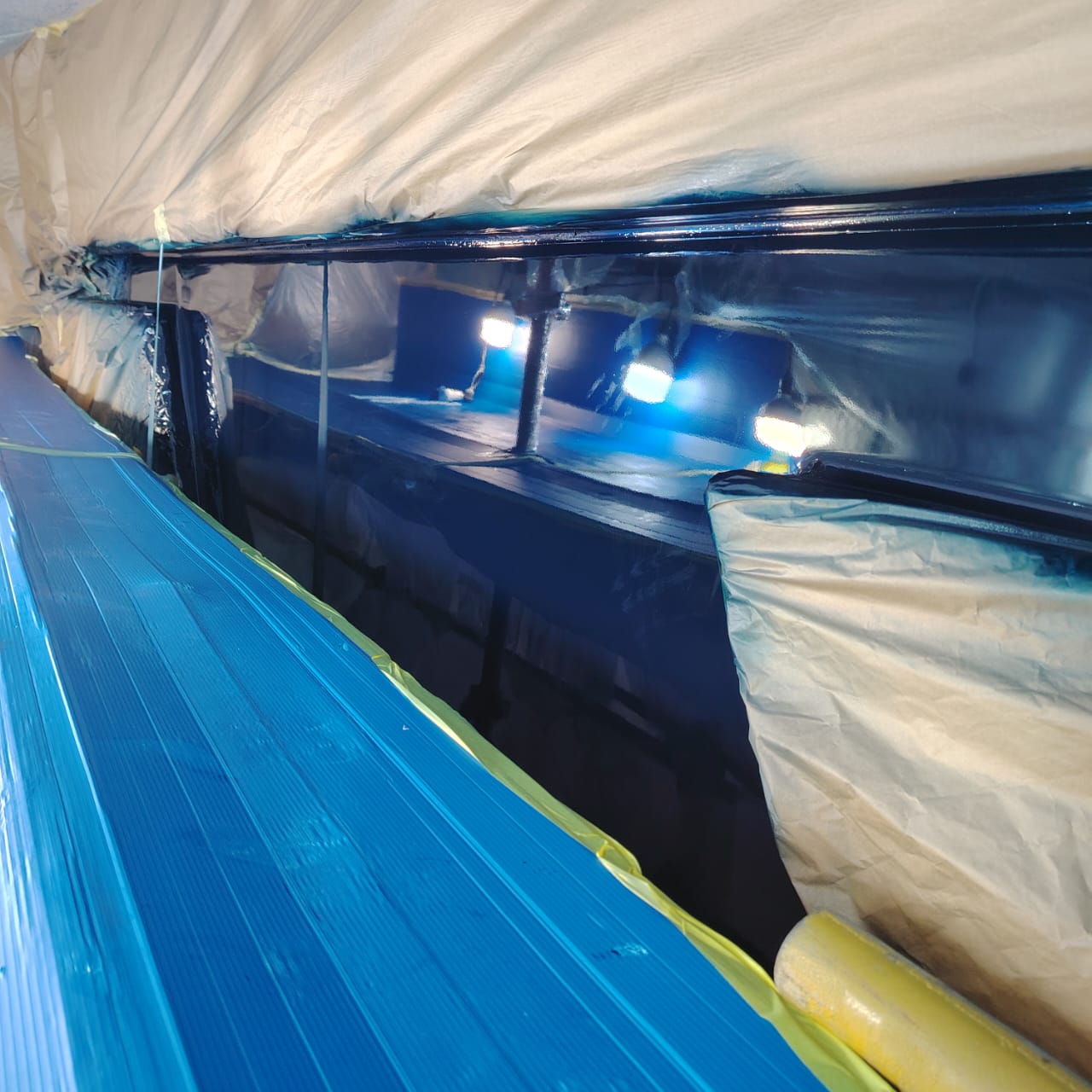 Yacht painting project 1 — topcoat application in progress