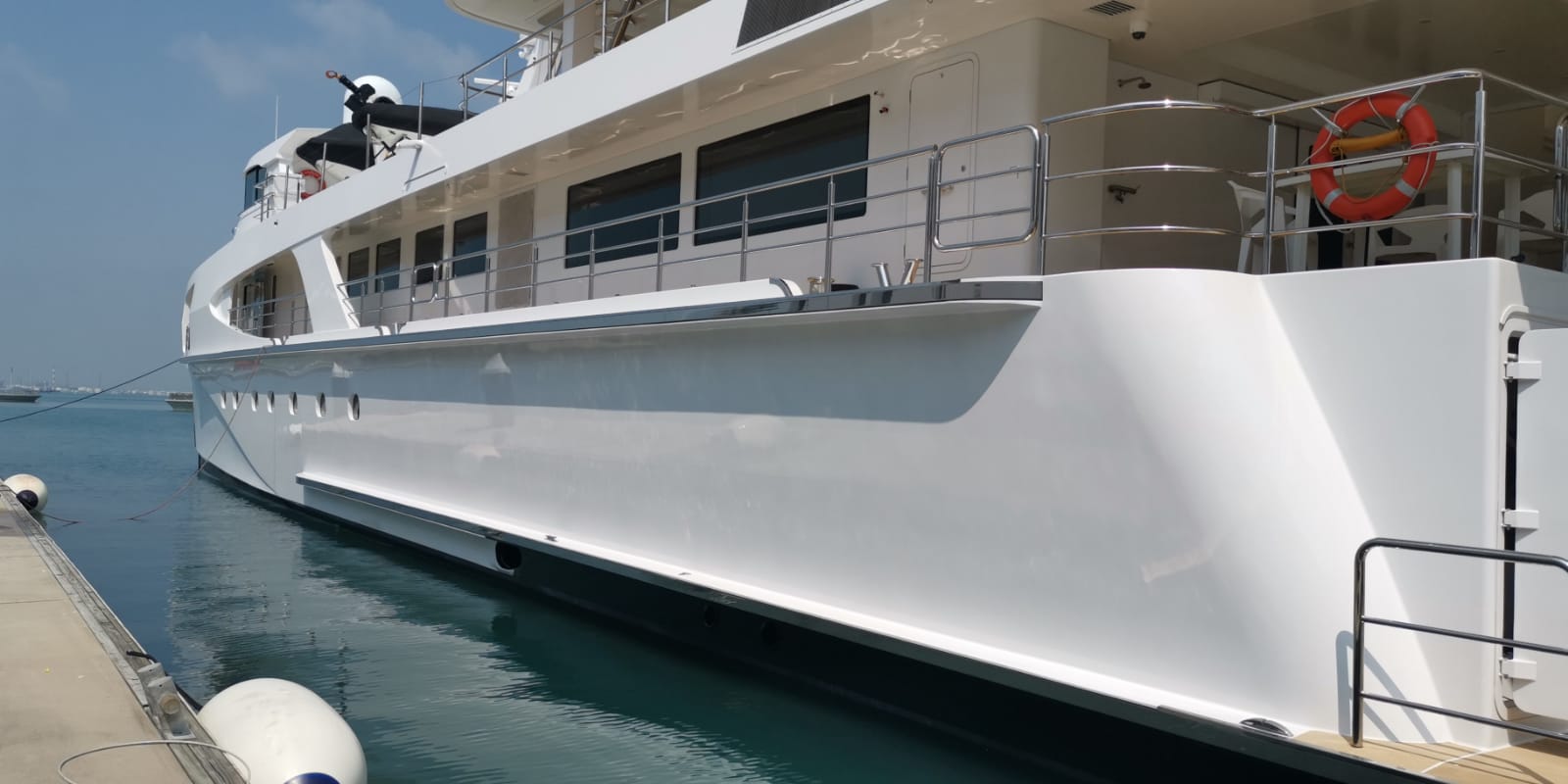 Professional yacht polishing — portside surface finishing result