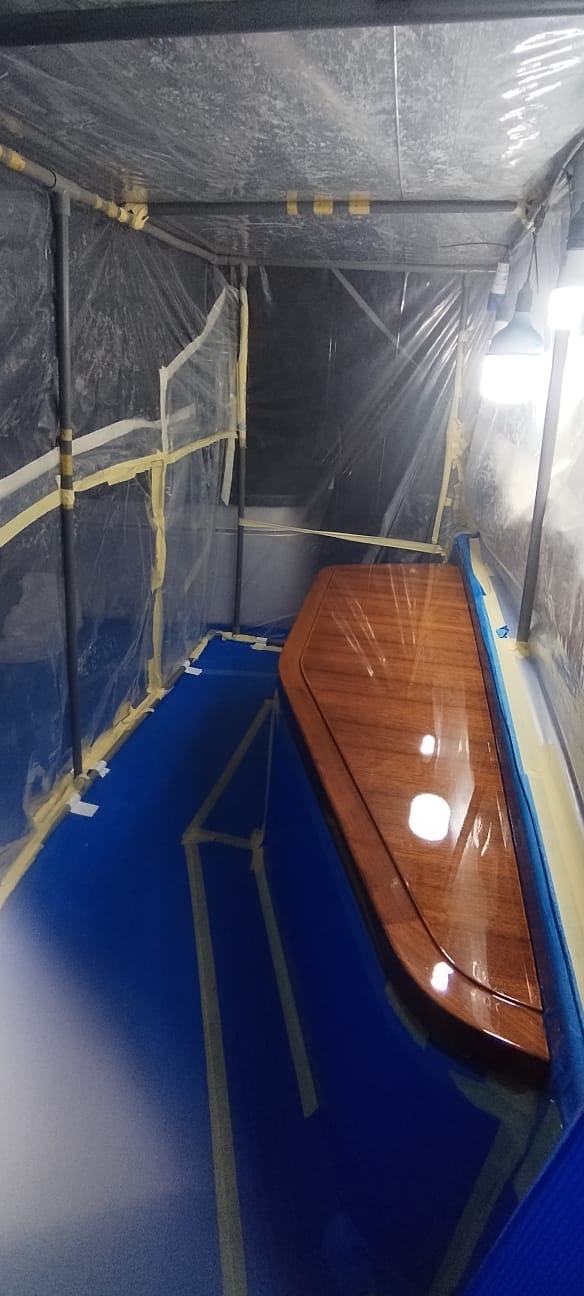 Yacht varnishing — completed deck varnish application